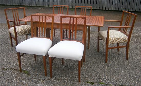 A Gordon Russell teak extending dining table and six chairs (4+2 carvers)